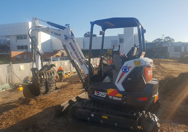 Big Excavator working on construction site in Epping