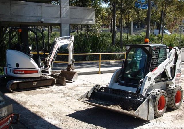 Bobcat and excavator working together in homebush